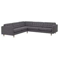 a gray sectional couch with chrome legs