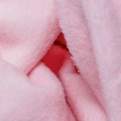 the pink blanket is soft and fluffy