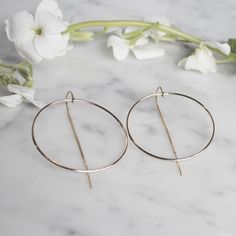 Best Seller and Camille's personal favorite hoops! Simple yet unique design with pull through design that make the perfect everyday hoop! Trust us...you will live in these! What is Gold Filled? Gold filled products consist of an actual layer of gold that is pressure bonded to another metal. Gold filling is one of the most valuable and tarnish resistant processes for creating gold jewelry and other items. If properly cared for, your gold filled product can last a lifetime and thanks to its durabi Gold Threader Earrings, Threader Earrings Gold, Gold Filled Hoops, Sell Gold, Gold Filled Earrings, Pull Through, Threader Earrings, Gold Hoops, Gold Filled Jewelry