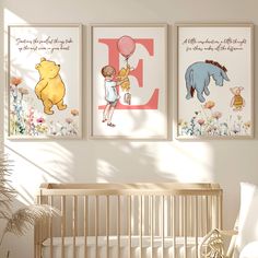 a baby's room with three posters on the wall and a crib next to it