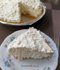 a piece of cake sitting on top of a white plate next to a pie pan