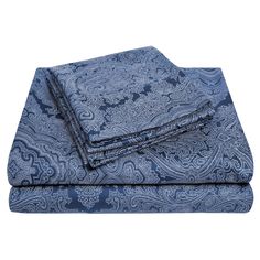 two blue paisley sheets folded on top of each other