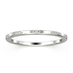 a white gold wedding ring with three diamonds