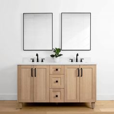 two mirrors are above the double sink vanity