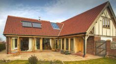 a house with a red tiled roof and windows