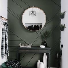 a black and white entryway with green accents