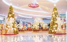 the entrance to a shopping mall decorated for christmas