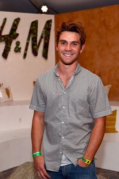 a man standing in front of a cake