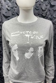 This is a woman's Cocteau Twins gray long sleeved top with ties at the side. This has a Cocteau image screen printed on the front. 100% Cotton These are handmade screenprinted and may slightly vary from the photo. Please feel free to email me any questions. Thanks for looking. Due to an influx of incorrect addresses if a package is returned, you must pay the shipping cost to resend the item to you. The seller is not responsible for any lost or stolen packages. Working At Target, Cocteau Twins, Black Cropped Tank, Black Crop Top Tank, Gray Top, Long Sleeved Top, Grey Top, Black Crop, Black Crop Tops