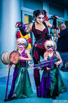 three women dressed in costumes posing for the camera