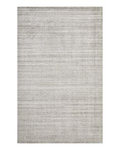 an area rug with grey and white stripes on the side, in front of a white background