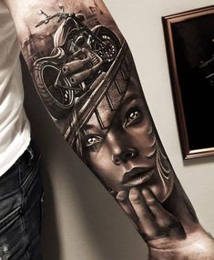 a person with a tattoo on their arm and the image of a woman's face