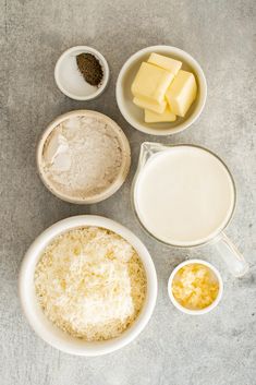 ingredients to make cheese pizza laid out in bowls