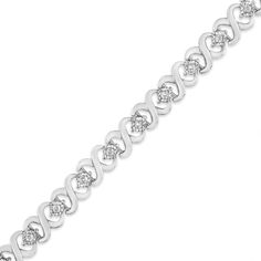 Dress up your everyday look with this classic infinity link diamond tennis bracelet. This piece is crafted from .925 sterling silver, a metal that will stay tarnish free for years to come. Boasting a design of silver "X" links, a miracle-plated round-cut diamond is brilliantly embellished between each link for added glamour. The bracelet has a total carat weight of 1/3 c.t., making it the perfect addition to your growing jewelry collection! Infinity Diamond Bracelet For Anniversary, Diamond Infinity Bracelet For Anniversary, Silver Infinity Diamond Bracelet For Formal Occasions, Infinity Diamond Bracelet With Accents For Anniversary, Silver Infinity Diamond Bracelet For Anniversary, Silver Infinity Bracelets With Diamond Accents, Anniversary Diamond Bracelet With Infinity Design, Classic Tennis Bracelet For Anniversary, Formal White Gold Infinity Diamond Bracelet