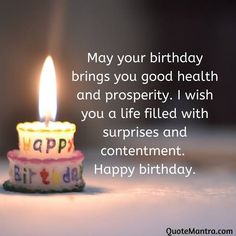 a birthday cake with a lit candle on it and the words, may your birthday brings you good health and prosperity i wish you a life filled with contentment