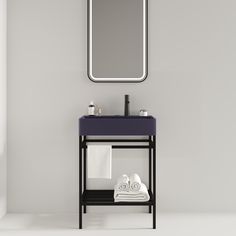 a bathroom with a sink, mirror and towel rack