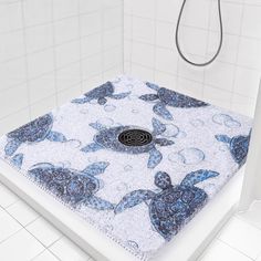 there is a shower with blue turtles on it