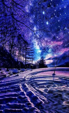 the night sky is filled with stars and clouds, as well as snow covered ground