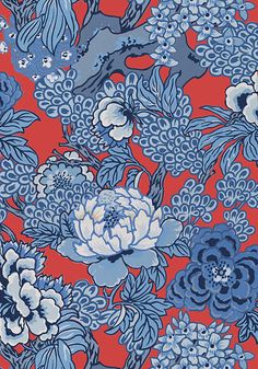 a red and blue flowered background with many different flowers on the same color scheme