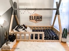 a wooden bed frame sitting on top of a white rug