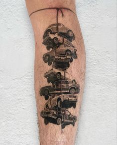 a man's leg with cars stacked on top of each other in black ink