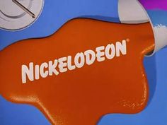 an orange and white sign with the word nickelodeon on it's side