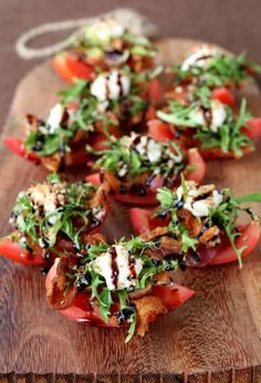 some food that is on top of a wooden cutting board and ready to be eaten