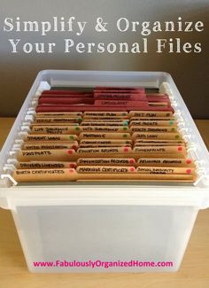 a plastic container filled with personal files on top of a table