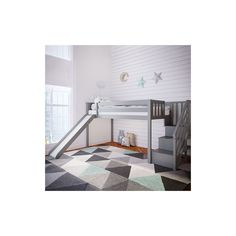 a child's bedroom with a loft bed, stairs and rugs on the floor