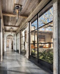 the inside of a house with large windows