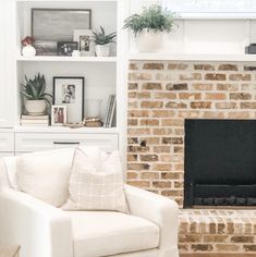 Neutral living room Neutral Brick Fireplace, Chicago Brick Fireplace, Restoration Hardware Chair, Classic Fireplace, Cozy Spot, Neutral Living Room