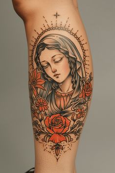 a woman's leg with tattoos on it