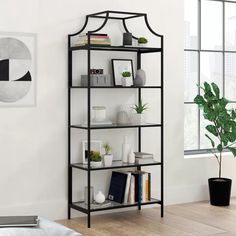 a book shelf in the corner of a room with a potted plant next to it