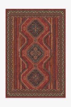 a red rug with an intricate design on it