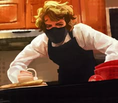 a man wearing a black mask and apron preparing food