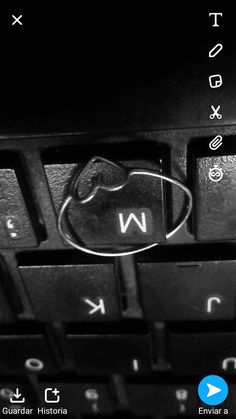 a close up of a keyboard with the letter w on it's key board