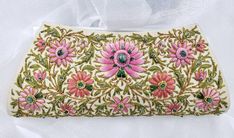 "Stunningly beautiful, opulent champagne colored silk clutch, expertly hand embroidered in silk and embellished with genuine jewels - star rubies, garnets, green onyx. This is a gorgeous wardrobe investment piece! Add instant glamour and elegance to any evening ensemble! Be bold and be noticed Exquisitely hand embroidered by master craftsmen in the historic city of Agra, India, home of the Taj Mahal. Embroidered front and back in the zardozi tradition, using metallic threads, silk and precious s Wedding Pink Embellished Clutch, Elegant Pink Bags For Receptions, Elegant Pink Bags For Reception, Elegant Embroidered Pink Clutch, Elegant Pink Clutch For Receptions, Elegant Pink Clutch For Reception, Pink Embroidered Clutch For Reception, Elegant Pink Clutch With Handwork, Pink Embroidered Clutch For Formal Occasions