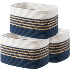 two blue and white baskets with gold stripes