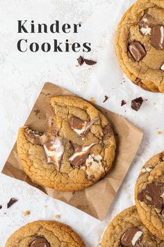 chocolate chip cookies with marshmallows on top and text overlay reading kinder cookies