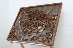 a piece of wood that has been made into a map on a easel stand