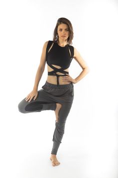 An edgy design yet comfy . Decorated on both sides with pleats , fitted ankles, elastic waist, low croch.More than just a baggy pair of pants..relaxed and beautiful. Sporty Stretch Harem Pants For Summer, Trendy Stretch Black Harem Pants, Stretch Harem Pants With Elastic Waistband And Tapered Leg, Trendy Black Stretch Harem Pants, Sporty Stretch Harem Pants With Elastic Waistband, Trendy Stretch Harem Pants With Elastic Waistband, Stretch Tapered Leg Parachute Pants For Loungewear, Stretch Tapered Leg Cargo Pants For Loungewear, Trendy Stretch Ankle-length Parachute Pants