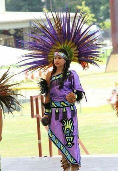 two women in native garb standing next to each other