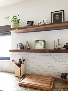 the kitchen counter is clean and ready to be used as a place for cutting vegetables