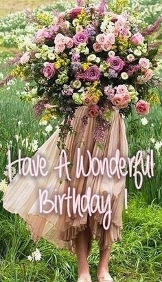 a woman holding a large bouquet of flowers in her hands with the words have a wonderful birthday