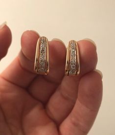 Item: Pair of Vintage 14K Gold White Stones Huggie Hoop Earrings. They are stamped 14K gold. The clear stones are unknown. They are not diamonds.Measurements: They weigh 4.57 grams. They measure 17mm tall and 10mm wide.Condition: Very good, previously owned. There is no damage to note.Please see our other listings, we combine shipping for savings.