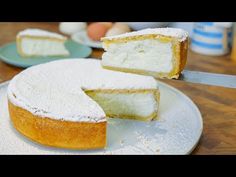 there is a cake that has been cut in half on the plate and ready to be eaten