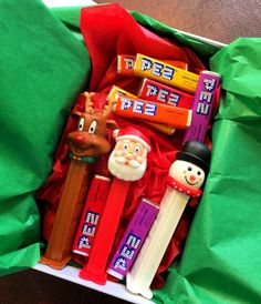 an assortment of toothbrushes in a box with santa claus and rudolph on it