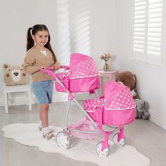 About this item Is your little one ready to embrace the world of imaginative play with their favourite doll duo? Look no further than the Dolly Tots Twin Dolls Pram - a charming and versatile pram designed to double the delight in every playtime adventure!Designed with precision and care, the Dolly Tots Twin Dolls Pram is the perfect accessory for your child's budding imagination. Watch as they embark on twinning escapades, nurturing their dolls with love and laughter. The Dolly Tots Twin Dolls Baby Dedication Party, Baby Remembrance, Kids Pretend Play Toys, Twin Pram, Twin Dolls, Doll Crib, Whatsapp Wallpaper Cute