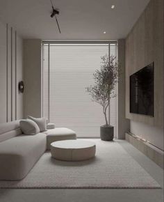 modern living room with white furniture and large windows