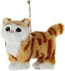 a brown and white cat ornament hanging from a string